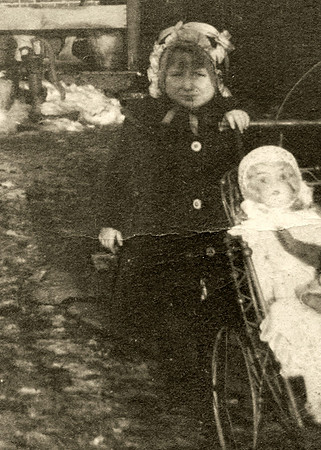 Erna with her doll in buggy