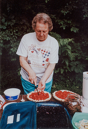 Grandma cutting her strawberry pies