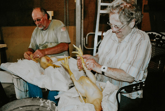 Bruce & Erna butchering chickens