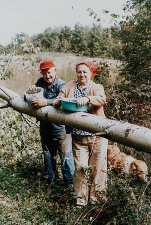 Grandpa and Grandma with grapes they picked and Molly