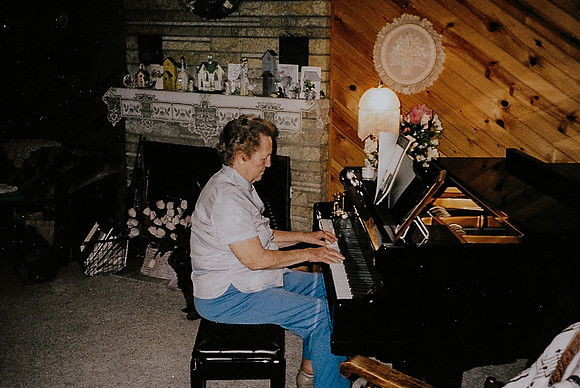 Erna trying out Marlene's new piano 1998