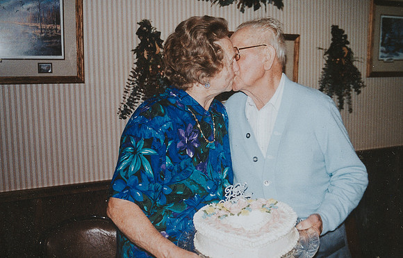 Grandma & Grandpa sharing a kiss